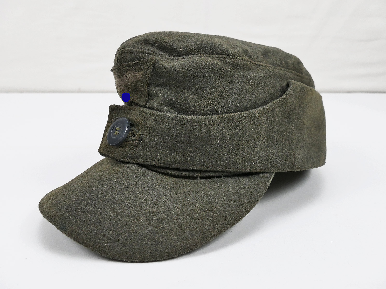 Luftwaffen Felddivision M43 Einknopf Feldmütze Gr.57 mit LW Trapez Effekten aus Museumsauflösung