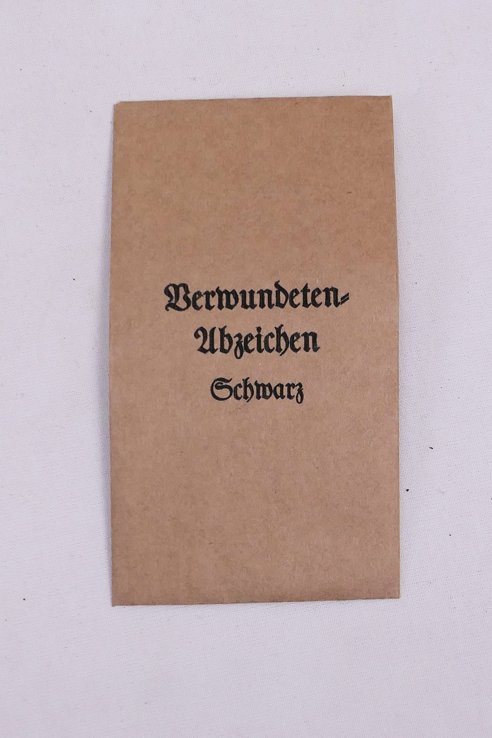 Wehrmacht Verleihungstüte für Orden + Auszeichnungen - Verwundeten Abzeichen schwarz